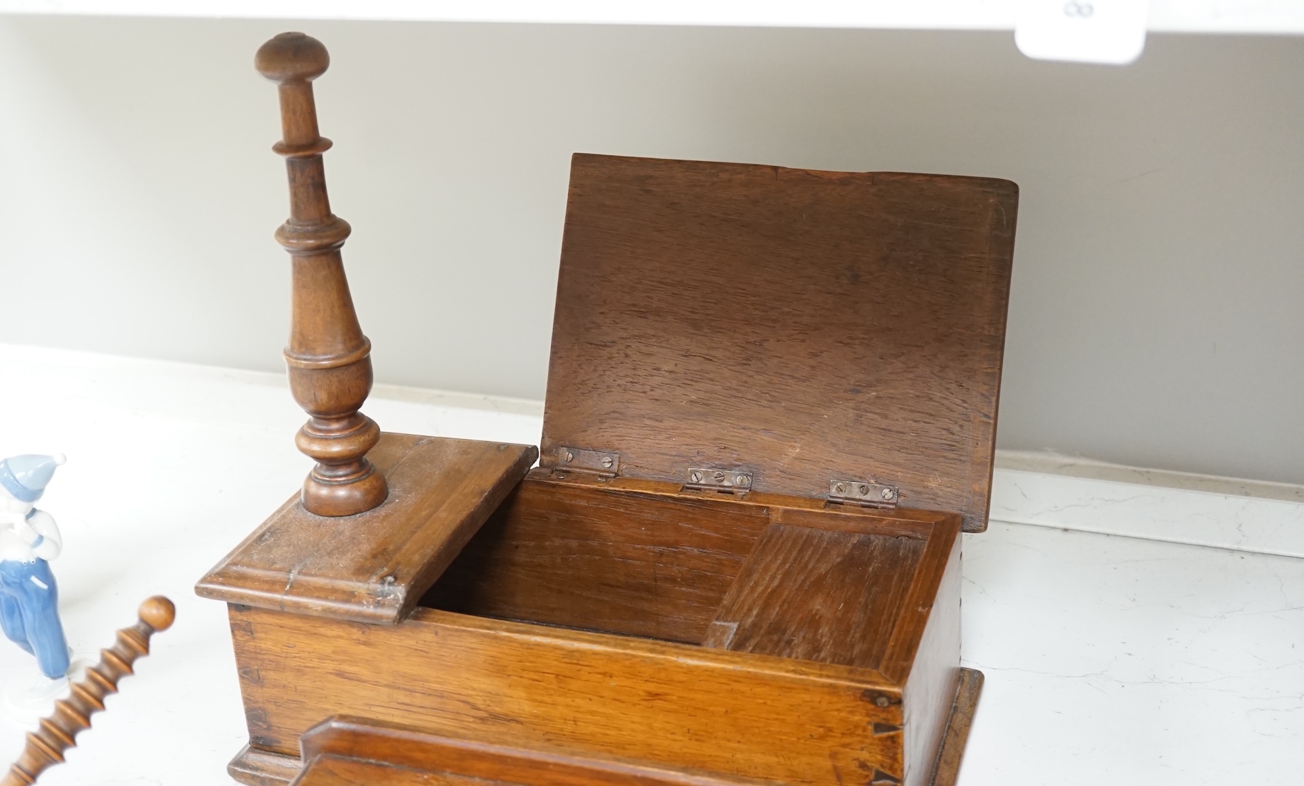 19th/early 20th century woodenware to include Pitcairn Islands circular box and treen ‘cat’ or plate stand, largest 44cm wide. Condition - fair to good